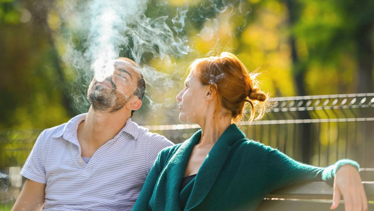 Man and woman smoking weed.