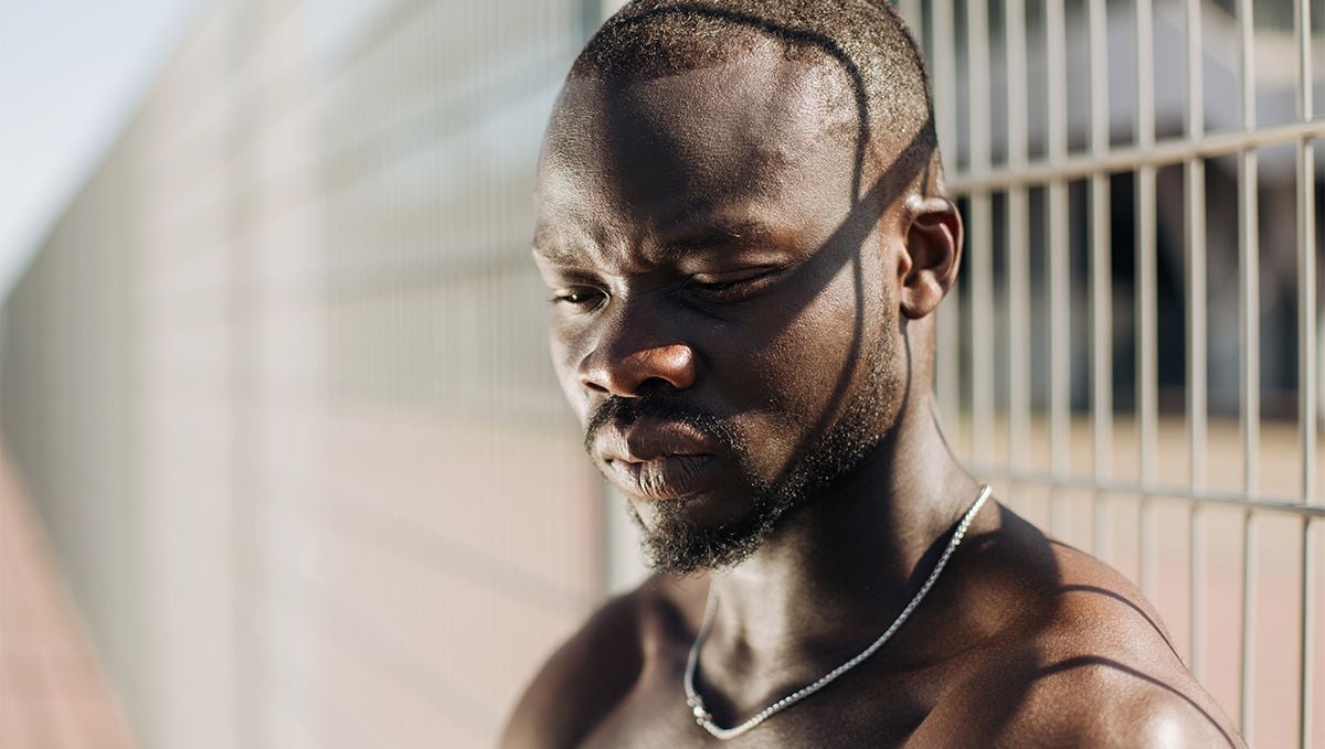 Weed in the Bahamas: Cannabis Legal Status Guide: A black young man in a prison